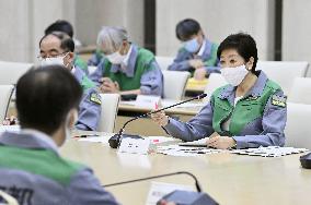 Tokyo lowers coronavirus alert level