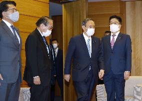 Japan Cabinet OKs 73.6 tril. yen new stimulus to fight virus
