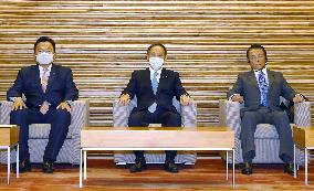 Japan Cabinet OKs 73.6 tril. yen new stimulus to fight virus