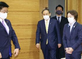 Japan Cabinet OKs extra budget for virus package