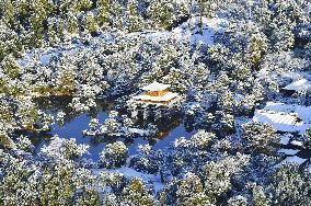 Snow-covered Kinkaku-ji temple