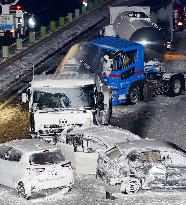 Multiple-vehicle collision on snow-blanketed expressway in northeastern Japan