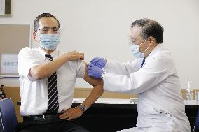 Japan begins COVID-19 vaccine to health workers