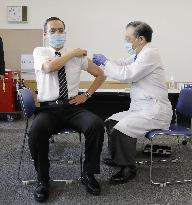 Japan begins COVID-19 vaccine to health workers