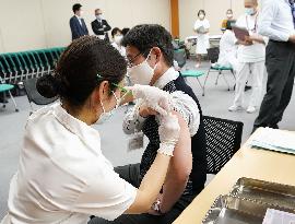 Japan launches COVID-19 vaccinations