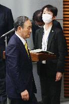 Japan gov't press official resigns amid scandal involving PM Suga's son