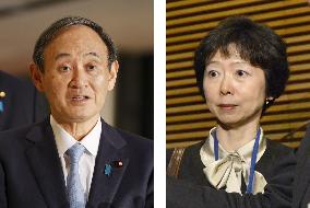 Japan PM Suga, press official who quit over scandal involving his son