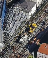 Scaffolding collapse alongside railway tracks in Tokyo