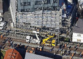 Scaffolding collapse alongside railway tracks in Tokyo