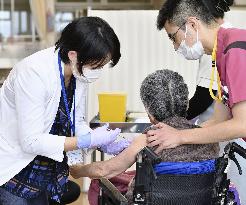 Japan starts COVID-19 vaccinations for elderly