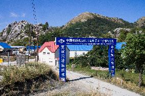 construction site of the Bar-Boljare motorway, highway, landscape, sign, gate, Chinese characters