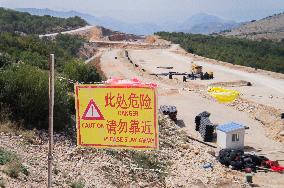 construction site of the Bar-Boljare motorway, highway, landscape, sign, warning CAUTION, DANGER,