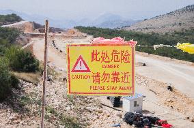 construction site of the Bar-Boljare motorway, highway, landscape, sign, warning CAUTION, DANGER,