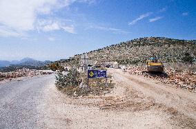 construction site of the Bar-Boljare motorway, Kosman tunnel, highway, landscape, sign, warning, Chinese characters