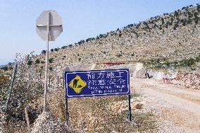 construction site of the Bar-Boljare motorway, highway, landscape, sign, warning, Chinese characters