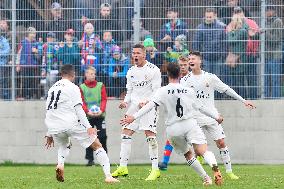 soccer players of Real Madrid U-19 celebrate a goal