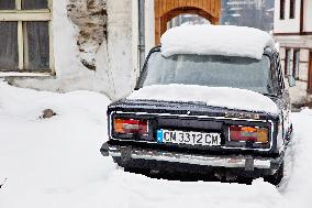 Shiroka Laka village, winter snow, passenger car Lada