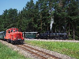 A couple of team and diesel locomotive, Rails