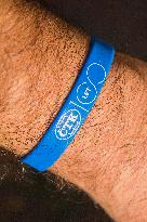 Printed Wristband Bracelet Silicone CTK 100 YEARS on a man`s hand