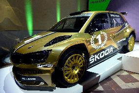 modernized rally car Skoda Fabia R5 by Skoda Motorsport, gold version