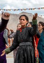 Ladakhi woman, traditional dress, dancing, Ladakh, Kashmir, India