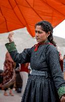 Ladakhi woman, traditional dress, dancing, Ladakh, Kashmir, India