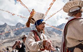 Ladakhi men, dancing, traditional dress, Ladakh, Kashmir, India