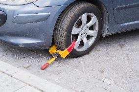 Korce (Korca) town, car, wheel boot, parking violation, immobilized, wheel clamp