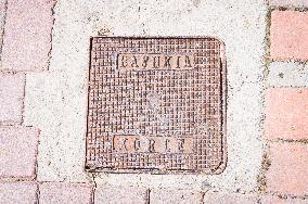 Korce (Korca) town, pavement, lid