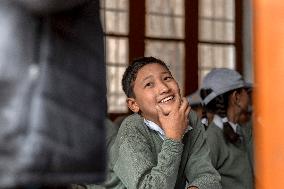 Ladakhi young boy, student, school, Leh, Himalayas, Ladakh, Kashmir, India