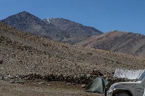 Nike logo, snow cap, mountains, tent, car, Himalyas, Ladakh, Kashmir, India