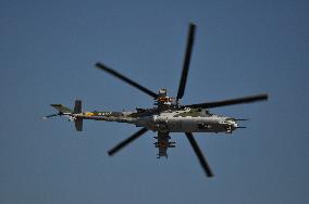 Mi-24 helicopter over airport, air force