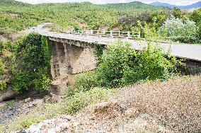 damaged bridge with SH6 road