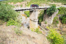 damaged bridge with SH6 road