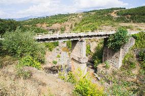 damaged bridge with SH6 road