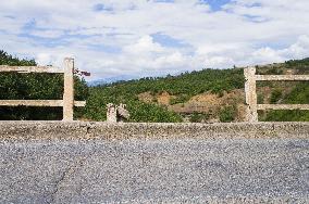 damaged bridge with SH6 road