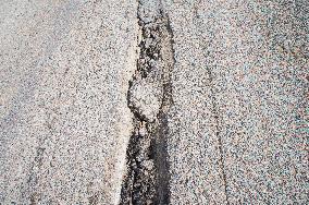 damaged bridge with SH6 road, surface, top, hole