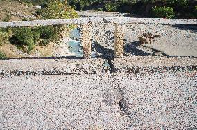 damaged bridge with SH75 road, surface, top, hole, confluence between Lengarica and Viosa River