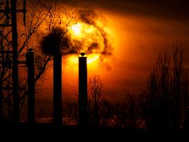 Sunset, chimneys, smoke