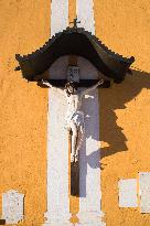 Jesus Christ on the cross, Catholic Parish Church of Saint Agathius, Schladming, winter, snow