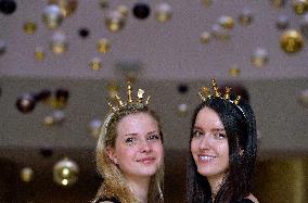 Two hostesses with chess crowns