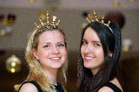 Two hostesses with chess crowns
