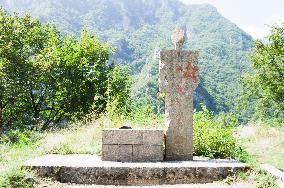 damaged, ruined WWII Monument