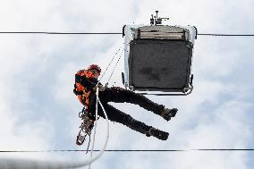 joint exercise of Czech and Polish firefighters on chairlift to Snezka Mountain in the Giant Mountains (Krkonose)