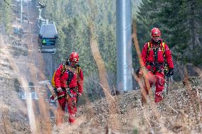 joint exercise of Czech and Polish firefighters on chairlift to Snezka Mountain in the Giant Mountains (Krkonose)