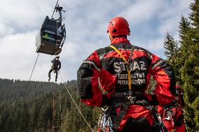 joint exercise of Czech and Polish firefighters on chairlift to Snezka Mountain in the Giant Mountains (Krkonose)