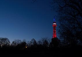 The lookout tower on Petrin hill lit in the French national colours