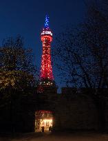 The lookout tower on Petrin hill lit in the French national colours