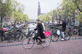 bikes parking on a bridge over a canal