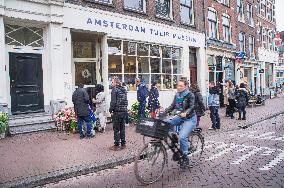 bicyclist pass the Amsterdam Tulip Museum